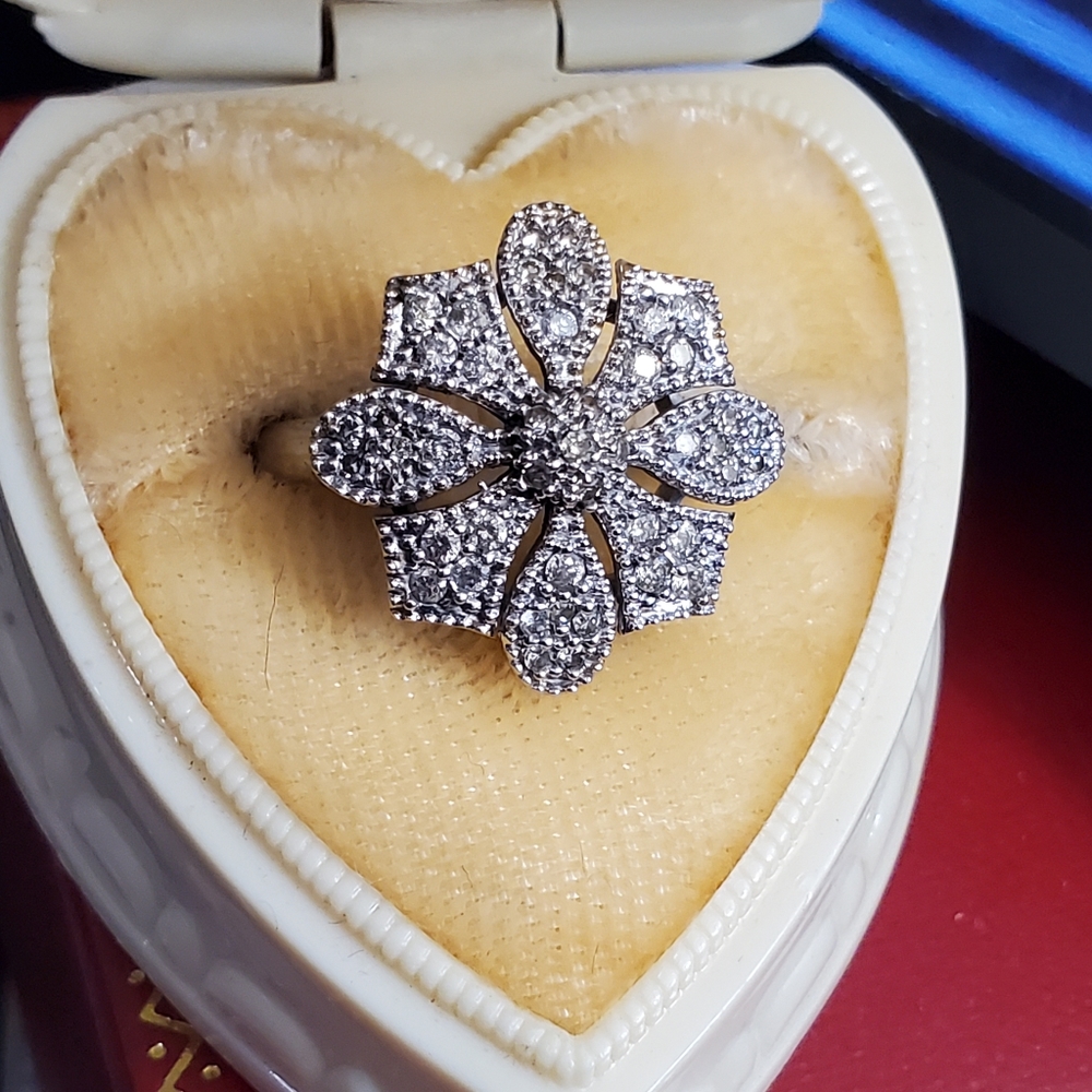 14k white gold genuine diamond ring size 6. Could be sized by a jeweler. Stamped